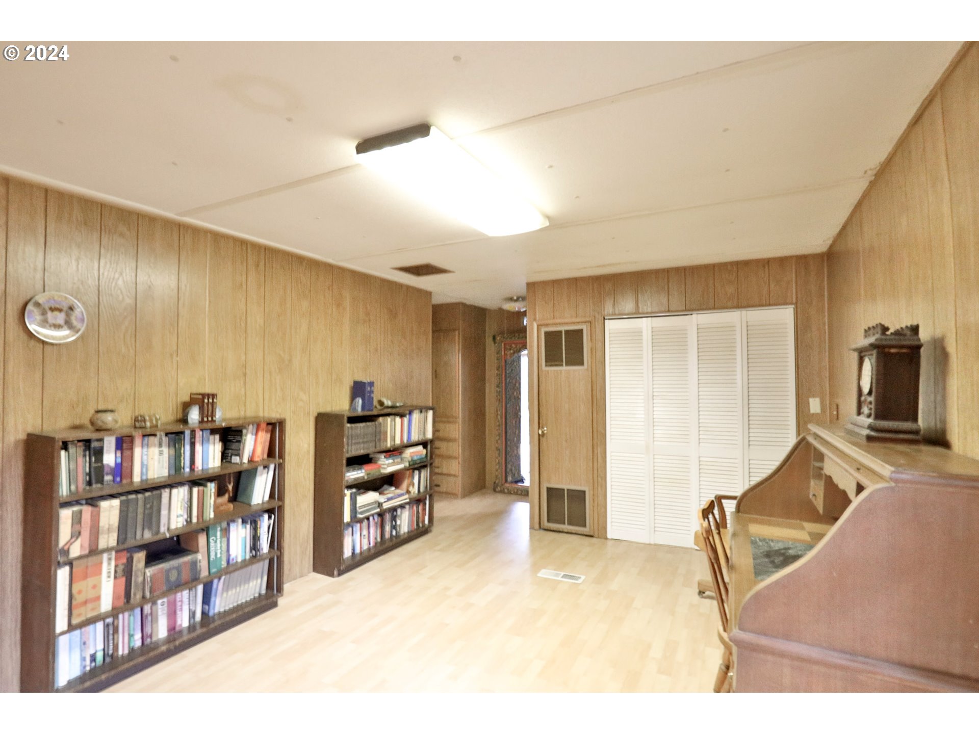 2073 Inland Way Springfield, OR 97477 - Photo 8 of 21 a living room with furniture cabinets and a flat screen tv