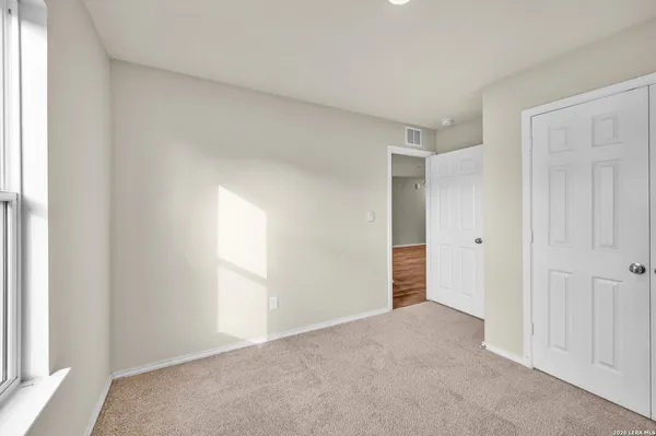 a view of an empty room and window