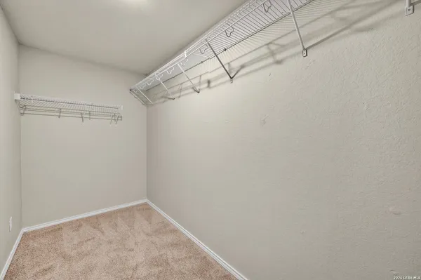 a view of a room with racks on the wall