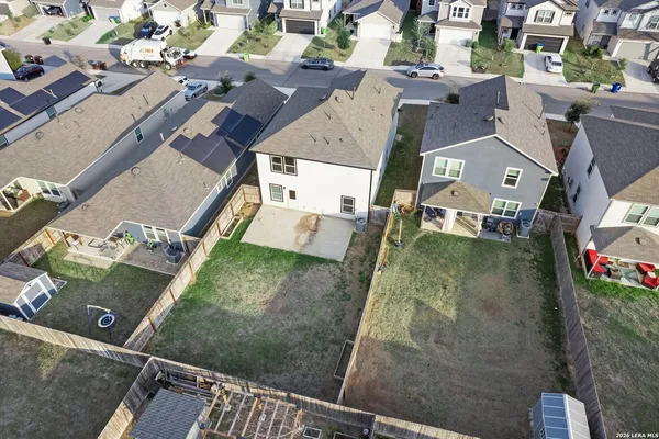 an aerial view of residential houses with outdoor space