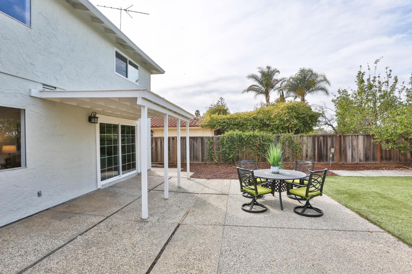 3059 Delta Road San Jose, CA 95135 - Photo 29 of 32 a view of a patio with table and chairs and potted plants