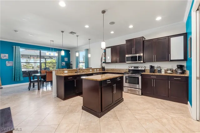 a kitchen with stainless steel appliances granite countertop a stove and a sink