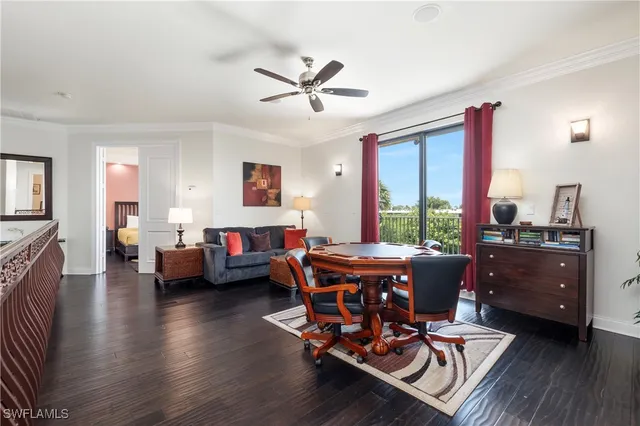 a bedroom with a bed and a television