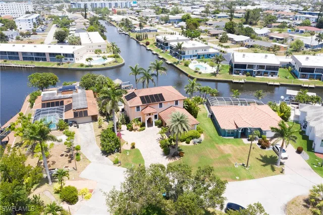 a view of swimming pool with a table and chairs
