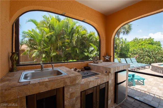 a view of a city from a dining room with large windows