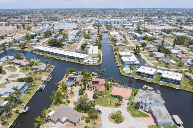 an aerial view of residential houses with yard
