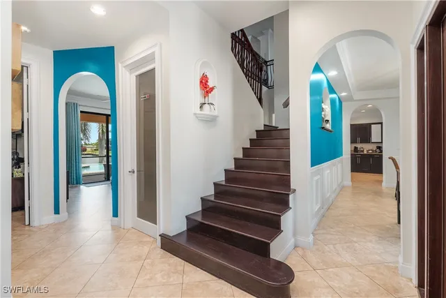 a view of a swimming pool with outdoor seating and lake view