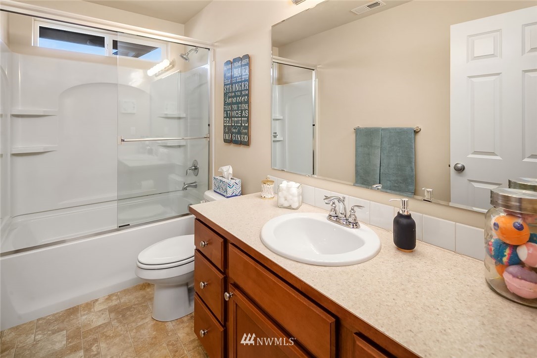 23019 42nd Drive Southeast Bothell, WA 98021 - Photo 14 of 19 a bathroom with a sink a toilet and shower