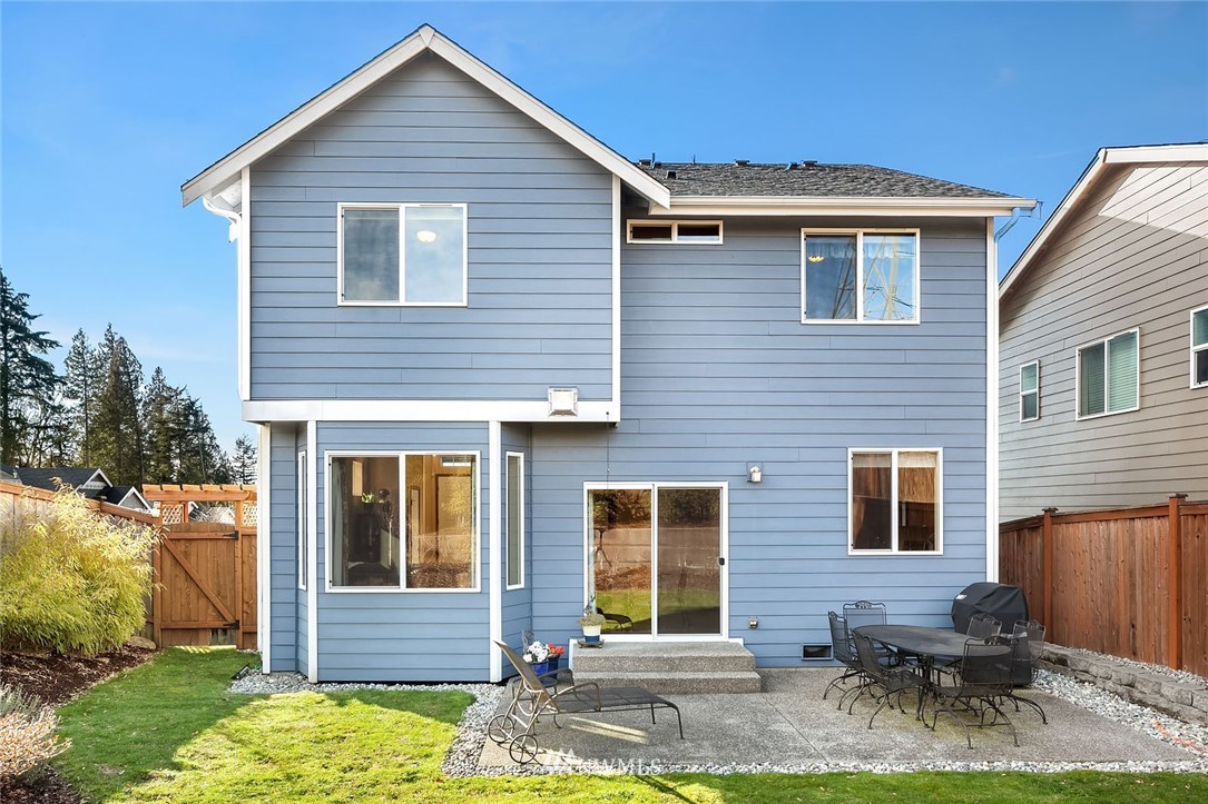 23019 42nd Drive Southeast Bothell, WA 98021 - Photo 16 of 19 a view of a house with yard and chairs in a yard