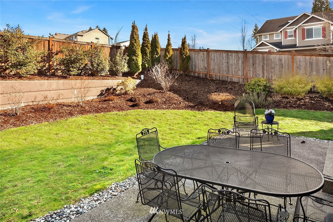 23019 42nd Drive Southeast Bothell, WA 98021 - Photo 17 of 19 a view of a chairs and table on the terrace