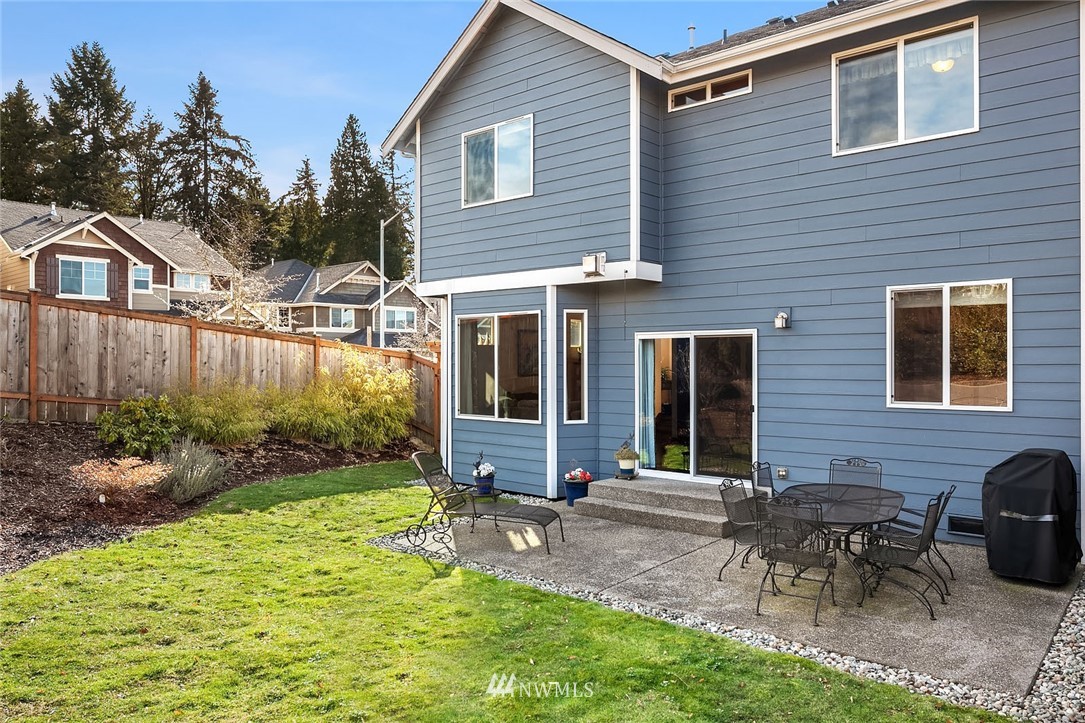 23019 42nd Drive Southeast Bothell, WA 98021 - Photo 19 of 19 a backyard of a house with table and chairs