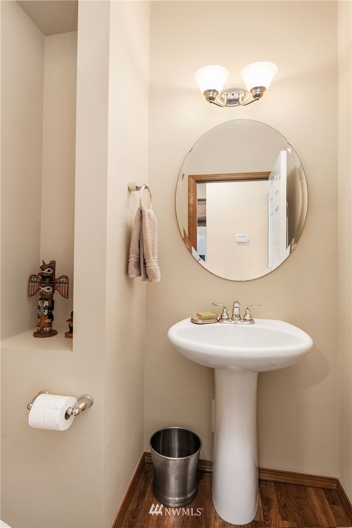 23019 42nd Drive Southeast Bothell, WA 98021 - Photo 7 of 19 a bathroom with a toilet sink and mirror