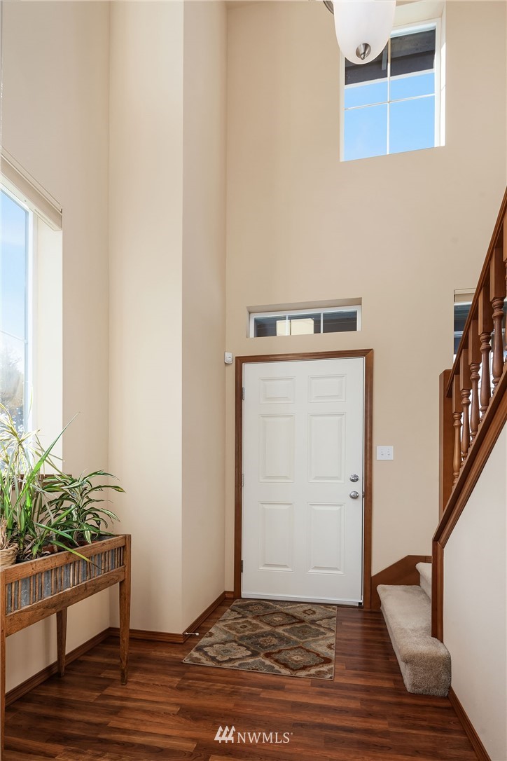 23019 42nd Drive Southeast Bothell, WA 98021 - Photo 8 of 19 a view of a hallway with wooden floor and a potted plant