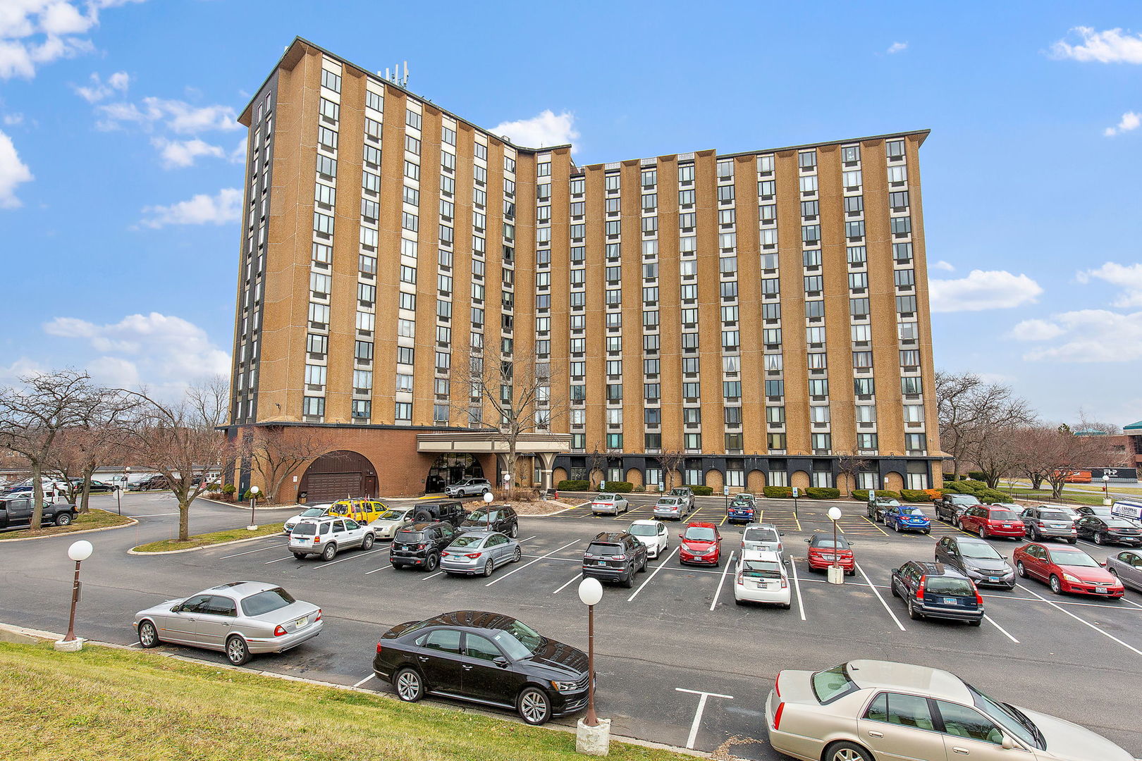 1 Renaissance Place, Unit 702 Palatine, IL 60067 - Photo 1 of 10 a cars parked in front of a building