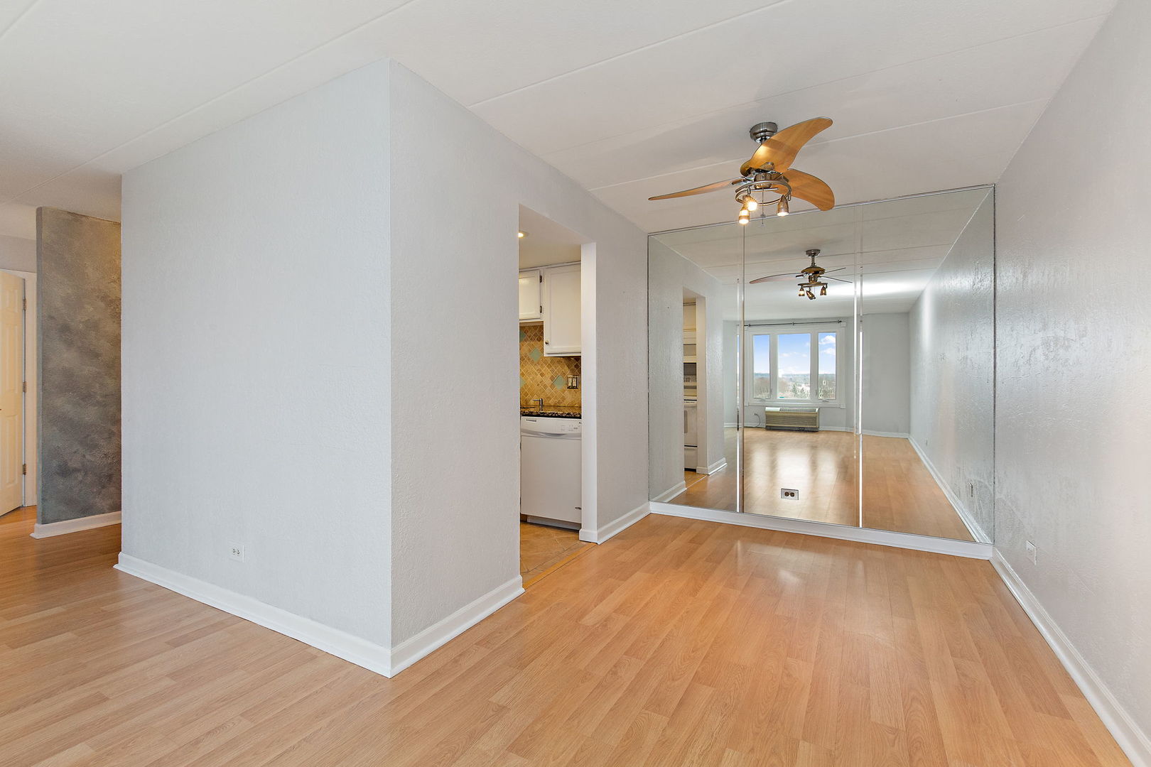 1 Renaissance Place, Unit 702 Palatine, IL 60067 - Photo 7 of 10 a view of a hallway with wooden floor and a bathroom
