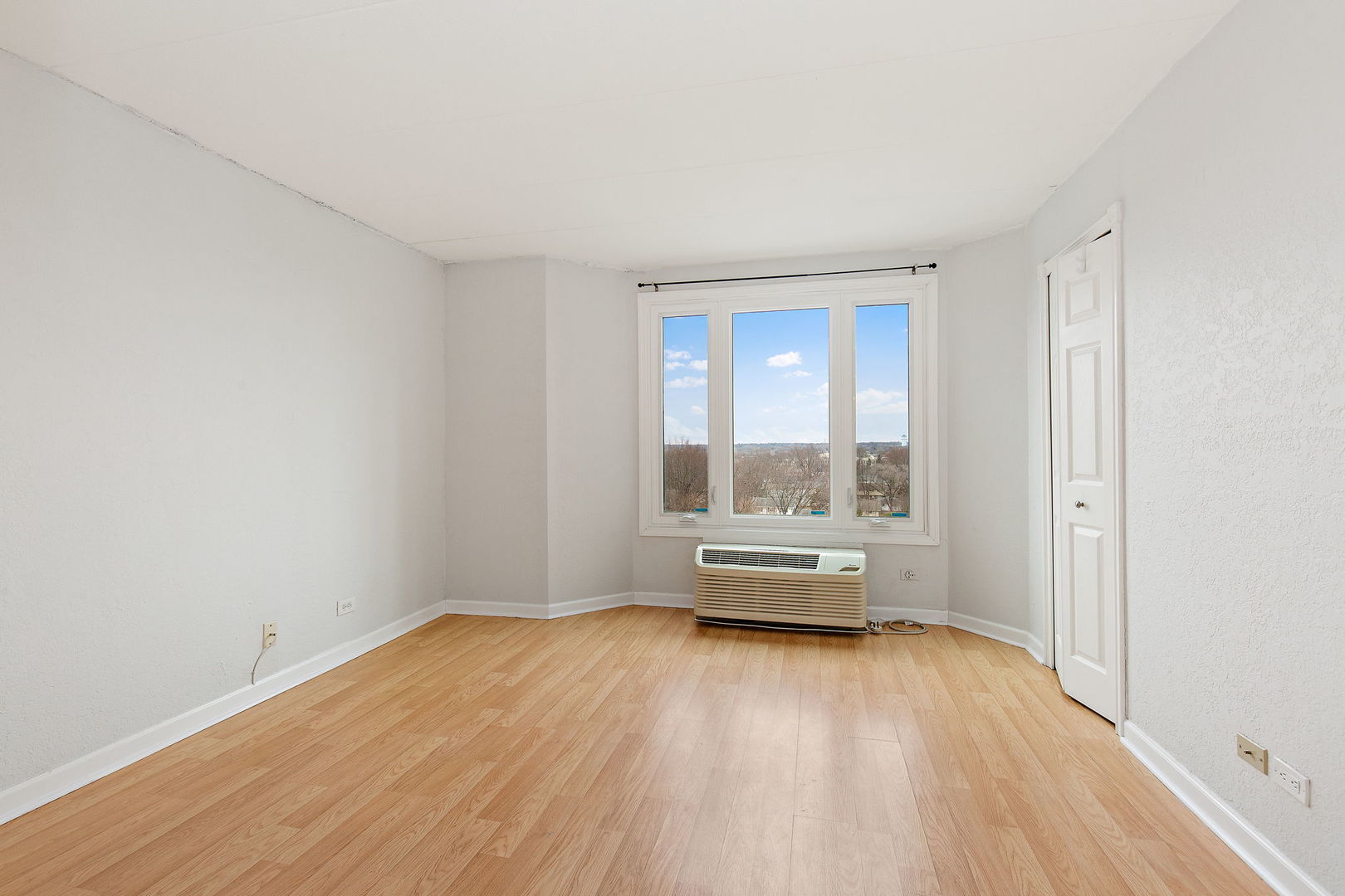 1 Renaissance Place, Unit 702 Palatine, IL 60067 - Photo 8 of 10 a view of empty room with wooden floor and fan