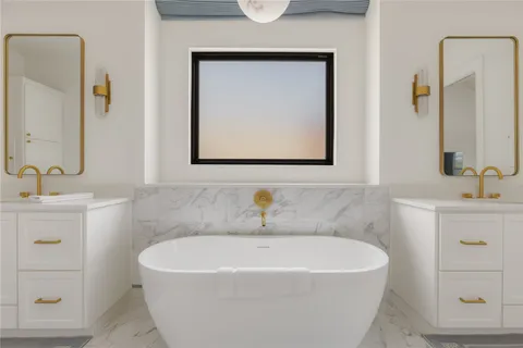 a bathroom with a toilet a sink and bathtub