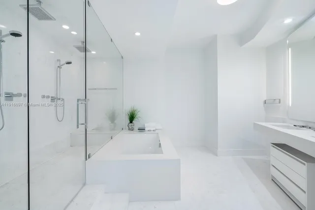 a bathroom with a bathtub and a sink