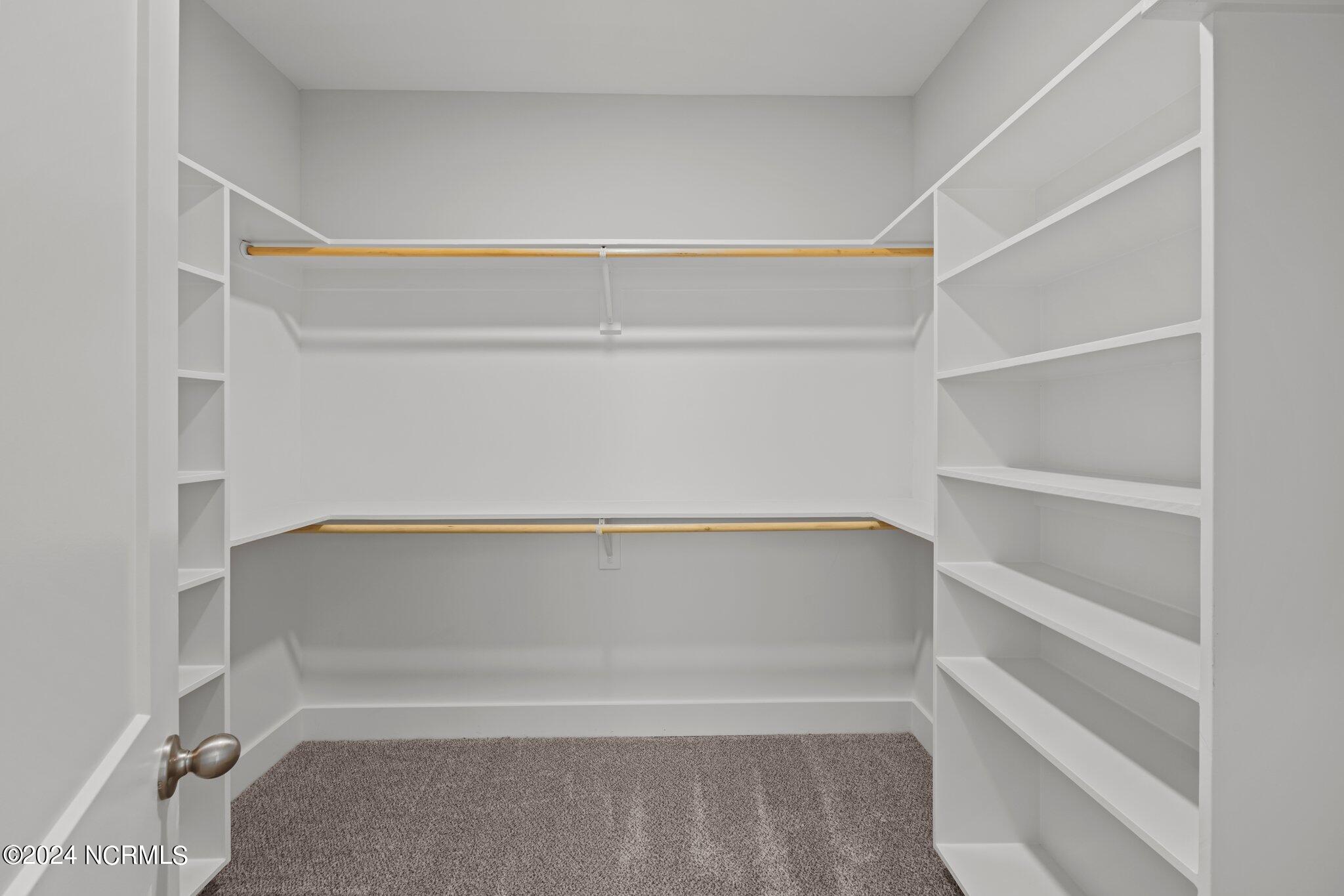 916 Aspen Ridge Court Deep Run, NC 28525 - Photo 23 of 39 Master bedroom walk in closet