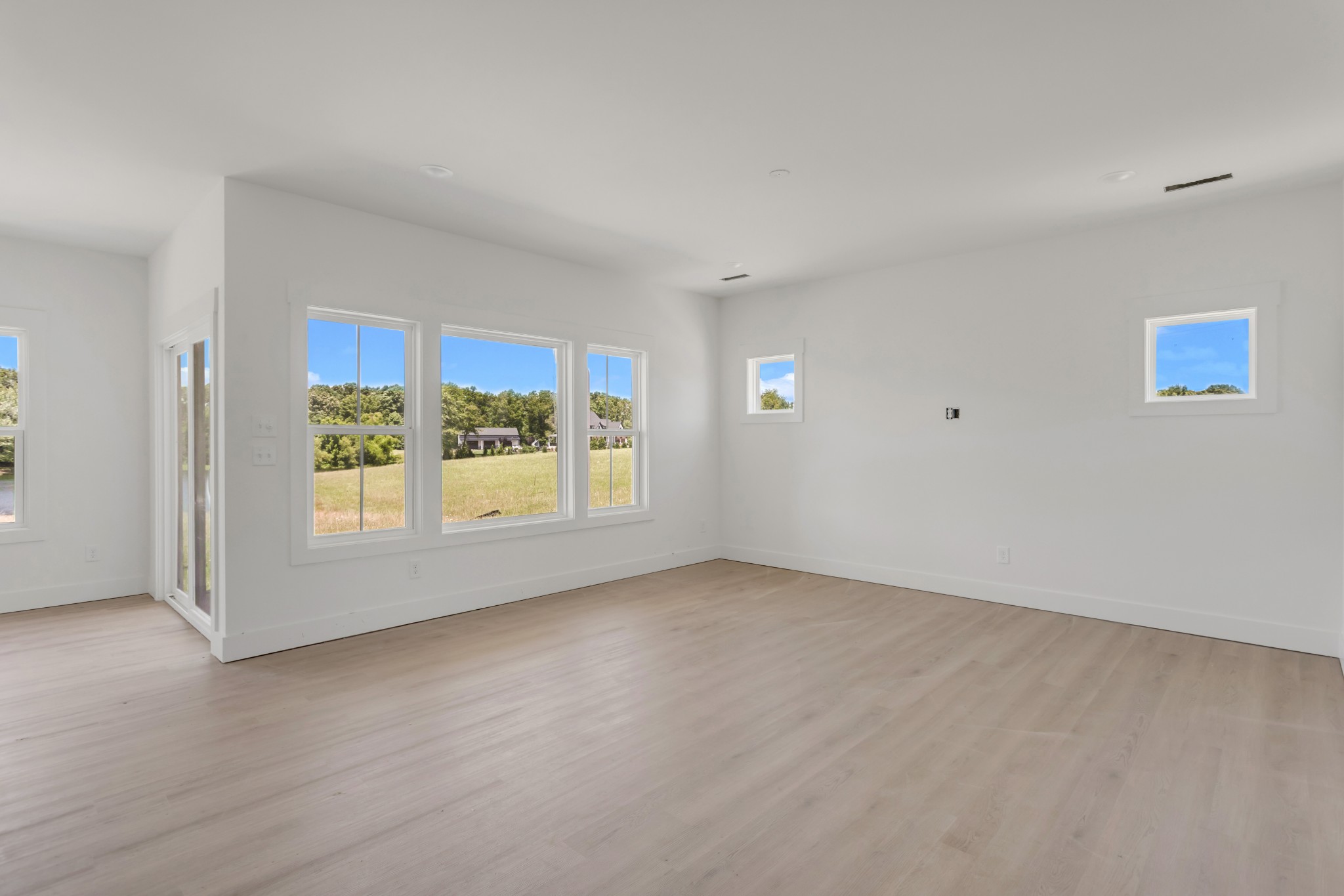 1171 Abiff Road Bon Aqua, TN 37025 - Photo 13 of 45 a view of an empty room with a window
