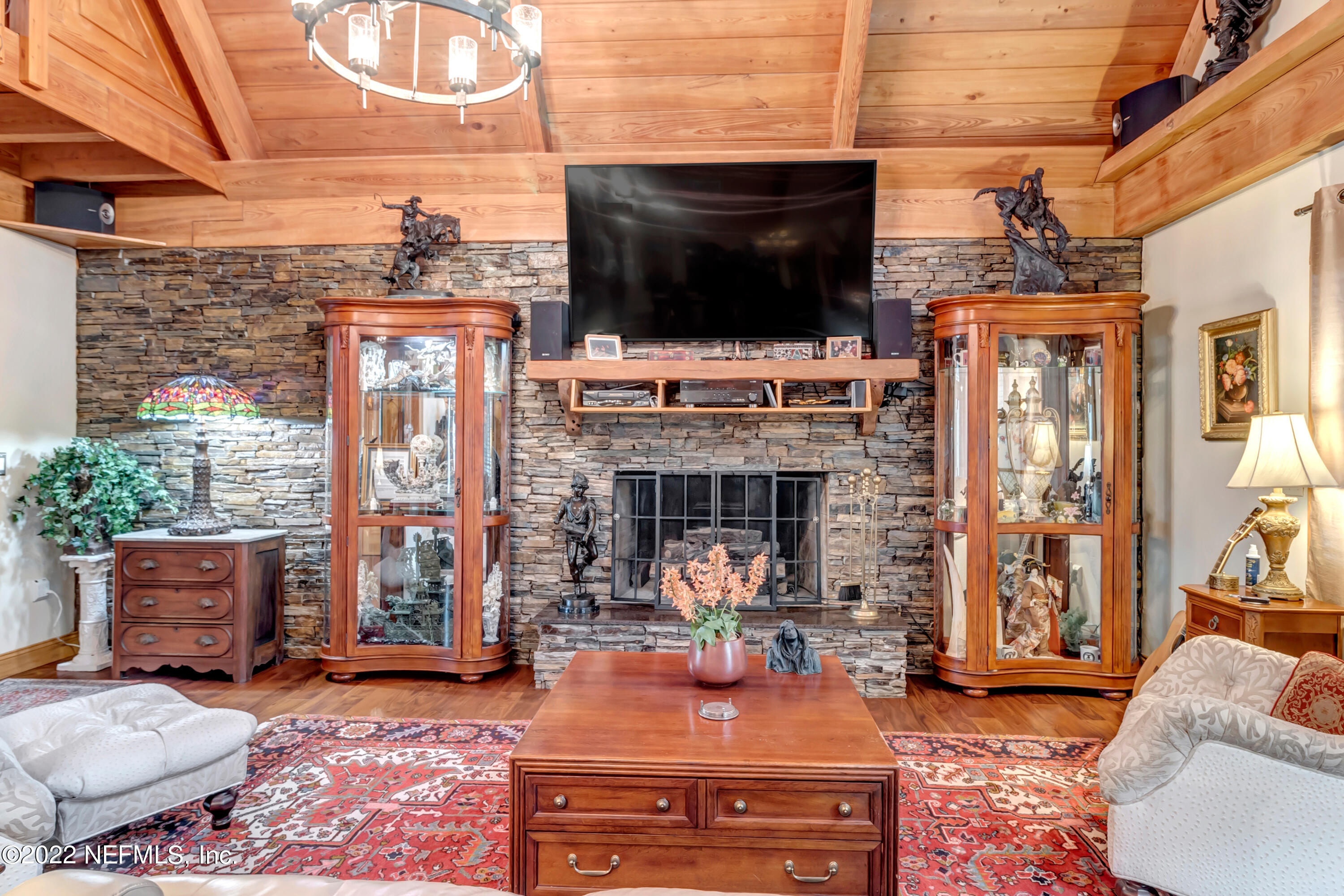 152 Marvin Jones Road Crescent City, FL 32112 - Photo 28 of 83 a living room with fireplace furniture and a flat screen tv