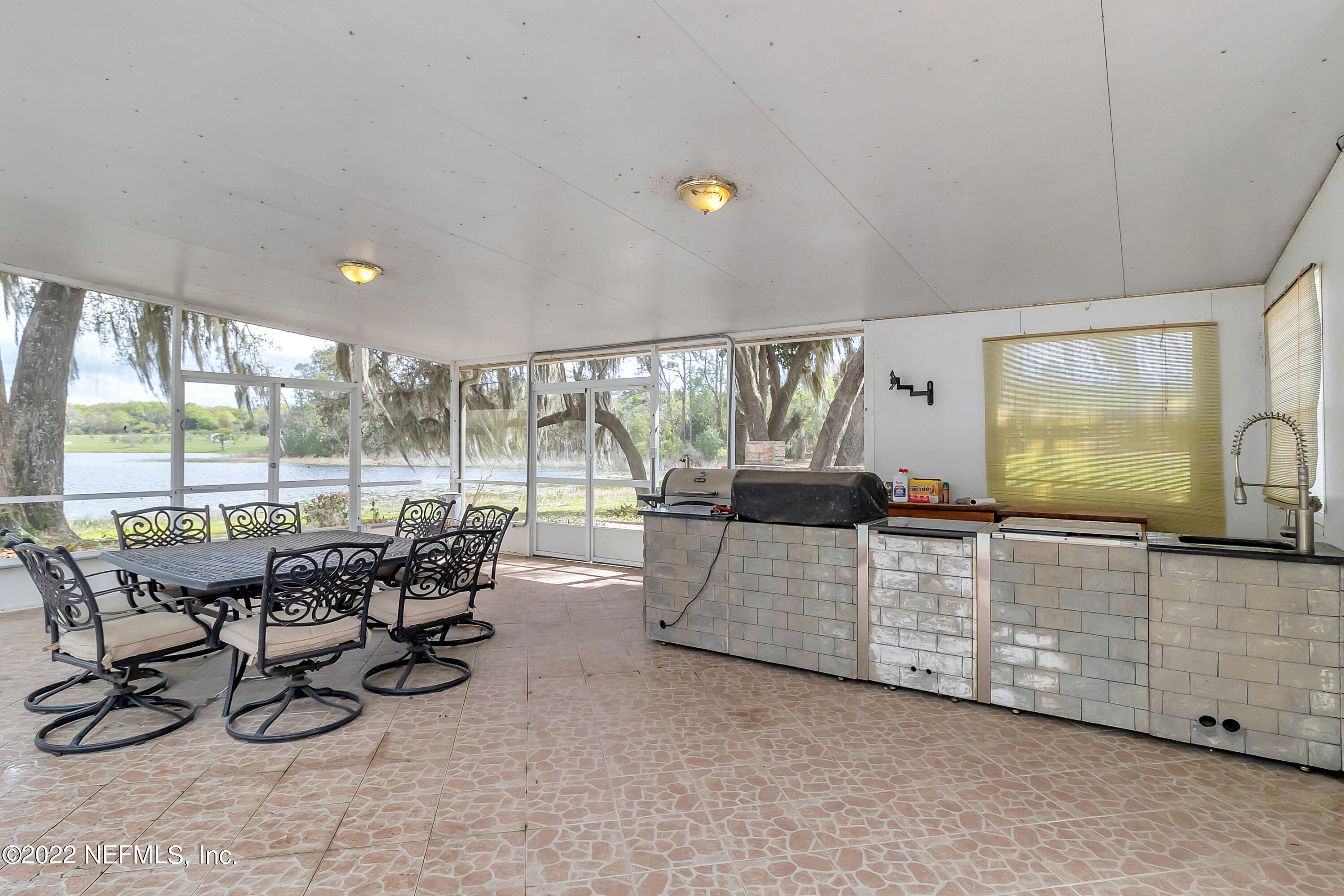 152 Marvin Jones Road Crescent City, FL 32112 - Photo 33 of 83 a view of a livingroom with furniture and floor to ceiling window