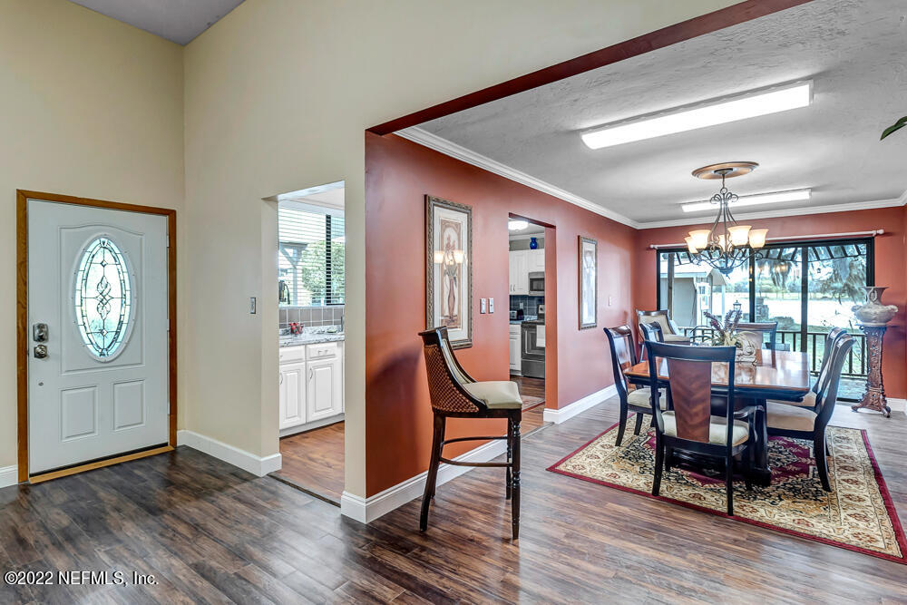 152 Marvin Jones Road Crescent City, FL 32112 - Photo 46 of 83 a view of a dining room with furniture window and wooden floor