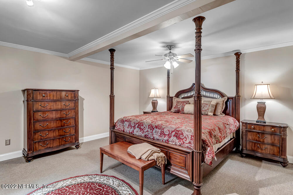 152 Marvin Jones Road Crescent City, FL 32112 - Photo 50 of 83 a bedroom with a bed a dresser and book shelf