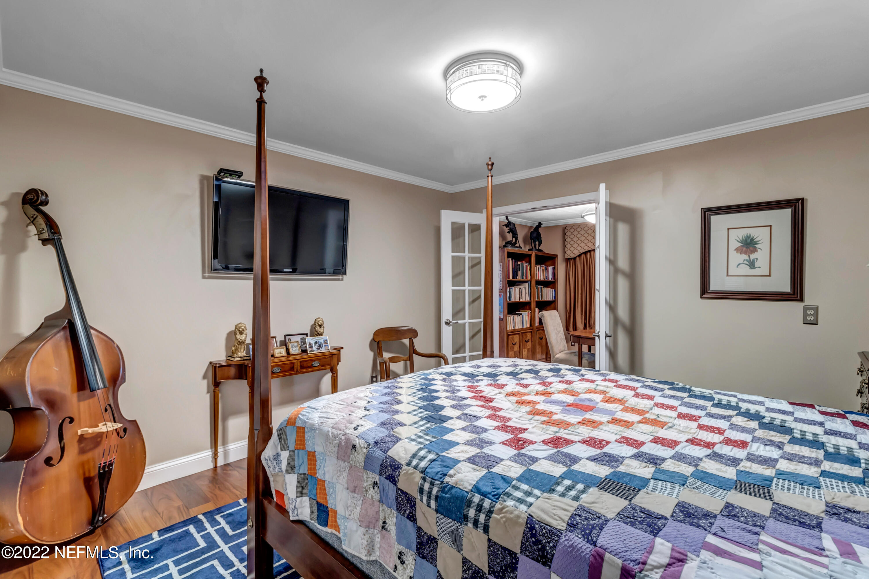 152 Marvin Jones Road Crescent City, FL 32112 - Photo 56 of 83 a bedroom with a bed a dresser and book shelf