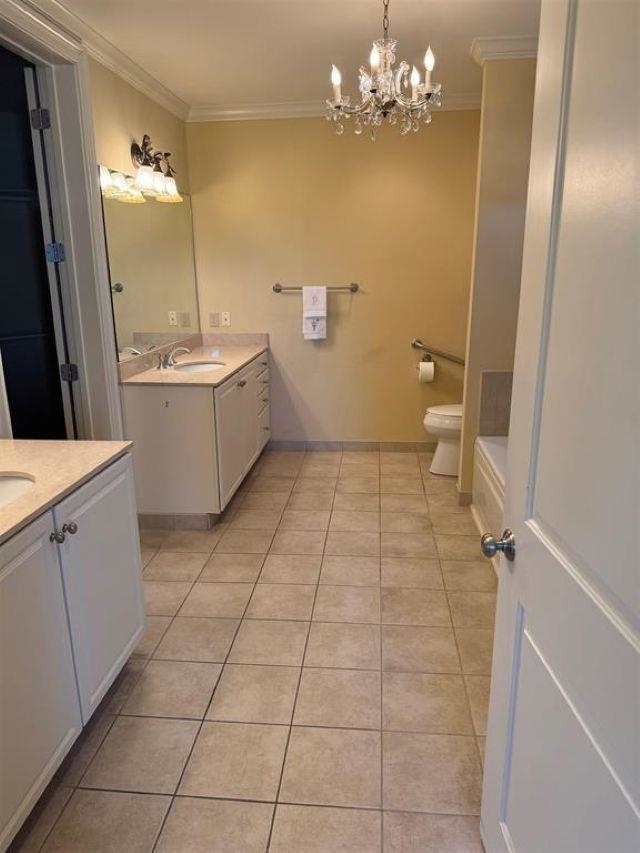 591 Lexington Road, Unit 201 Memphis, TN 38117 - Photo 10 of 11 a bathroom with a sink a toilet and shower