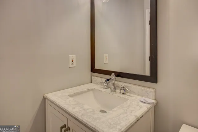 a white toilet sitting next to a shower curtain