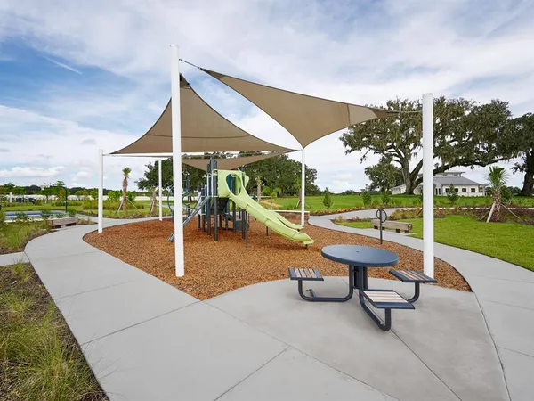 a view of a patio with a table and chairs