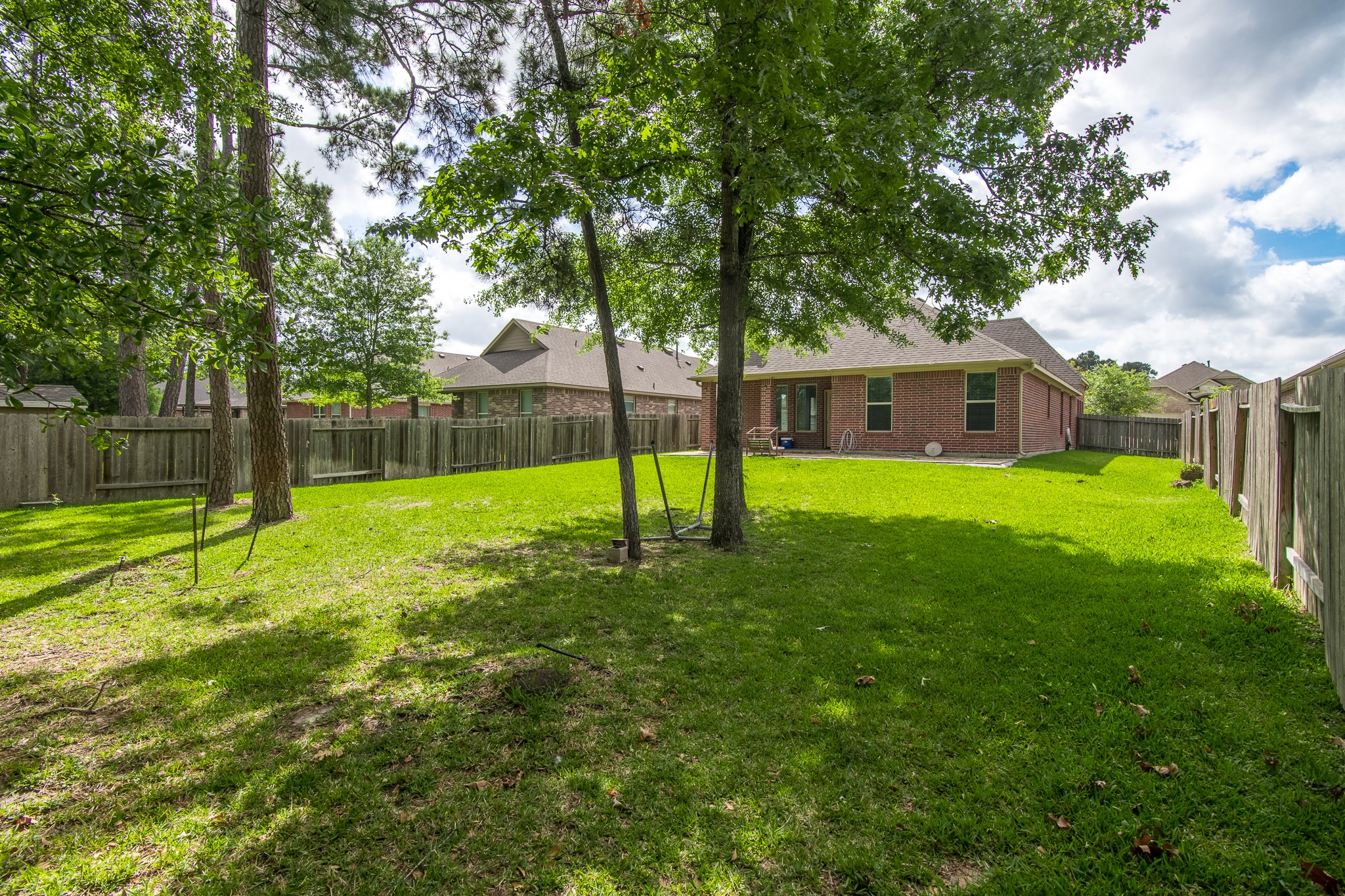 3211 Discovery Lane Conroe, TX 77301 - Photo 22 of 22 Spacious backyard with mature trees and no back neighbors
