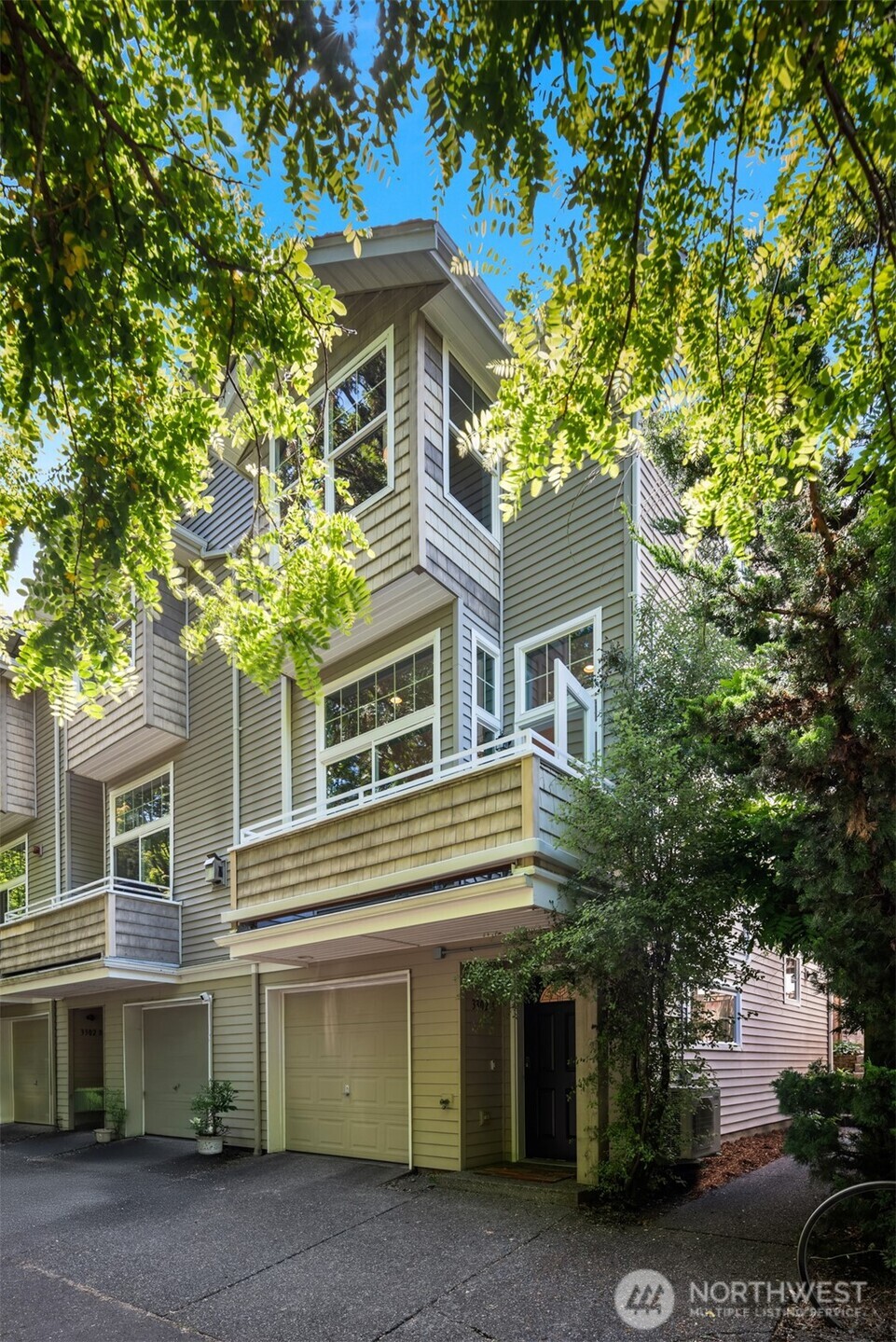 3302 West Government Way, Unit A Seattle, WA 98199 - Photo 31 of 32 a front view of a house with a garden