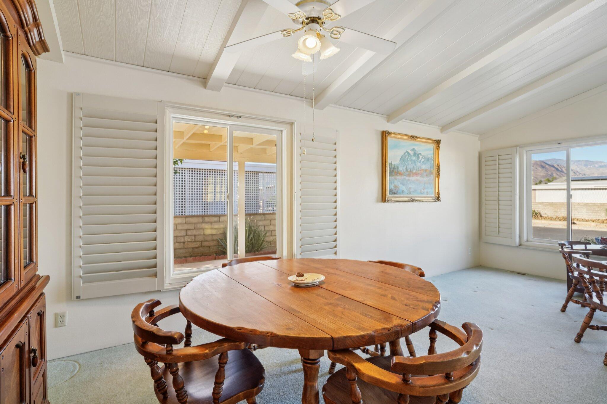 74584 Nevada Circle East Palm Desert, CA 92260 - Photo 11 of 46 a dining room with furniture and window