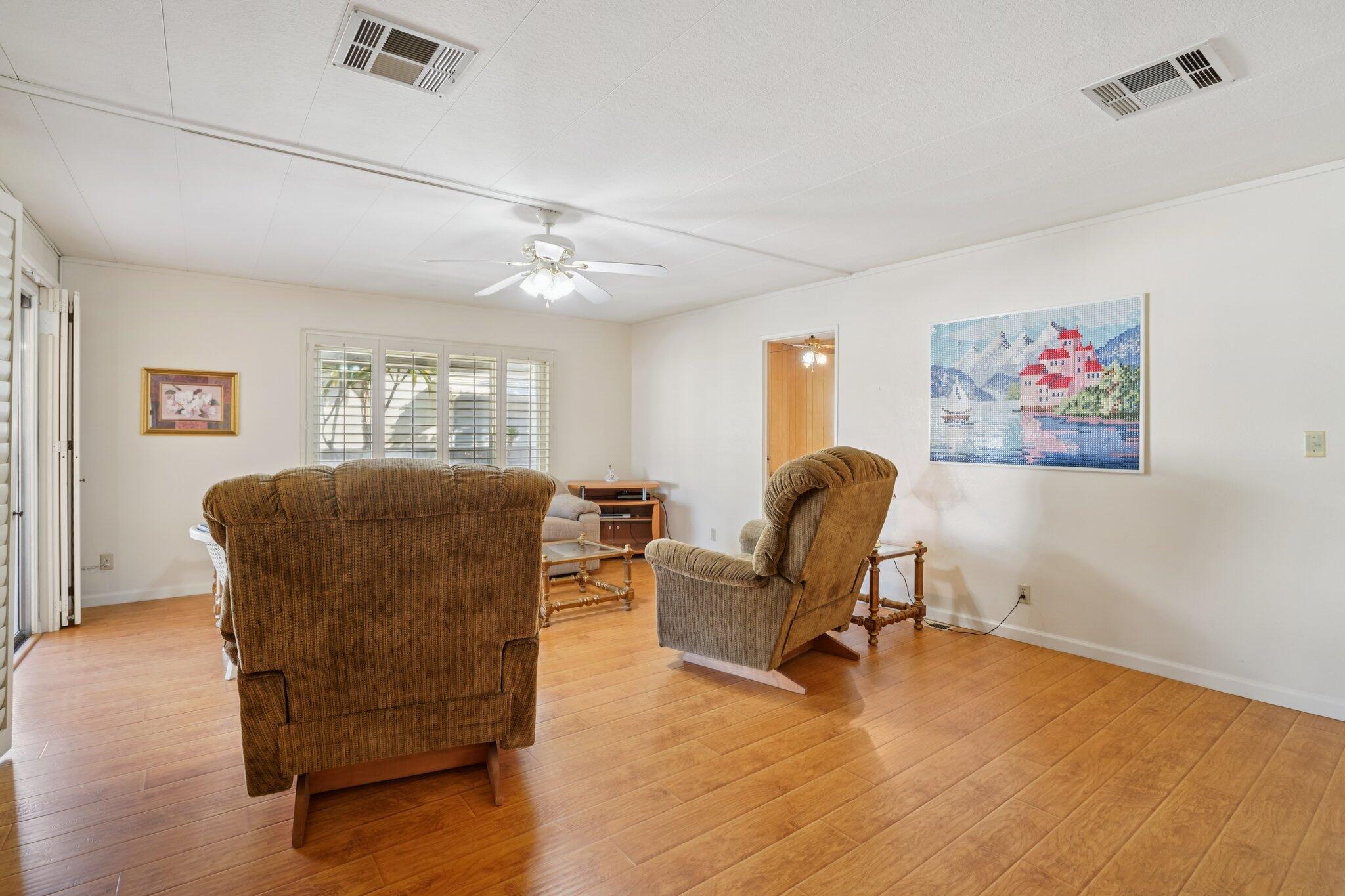 74584 Nevada Circle East Palm Desert, CA 92260 - Photo 14 of 46 a living room with furniture and a window
