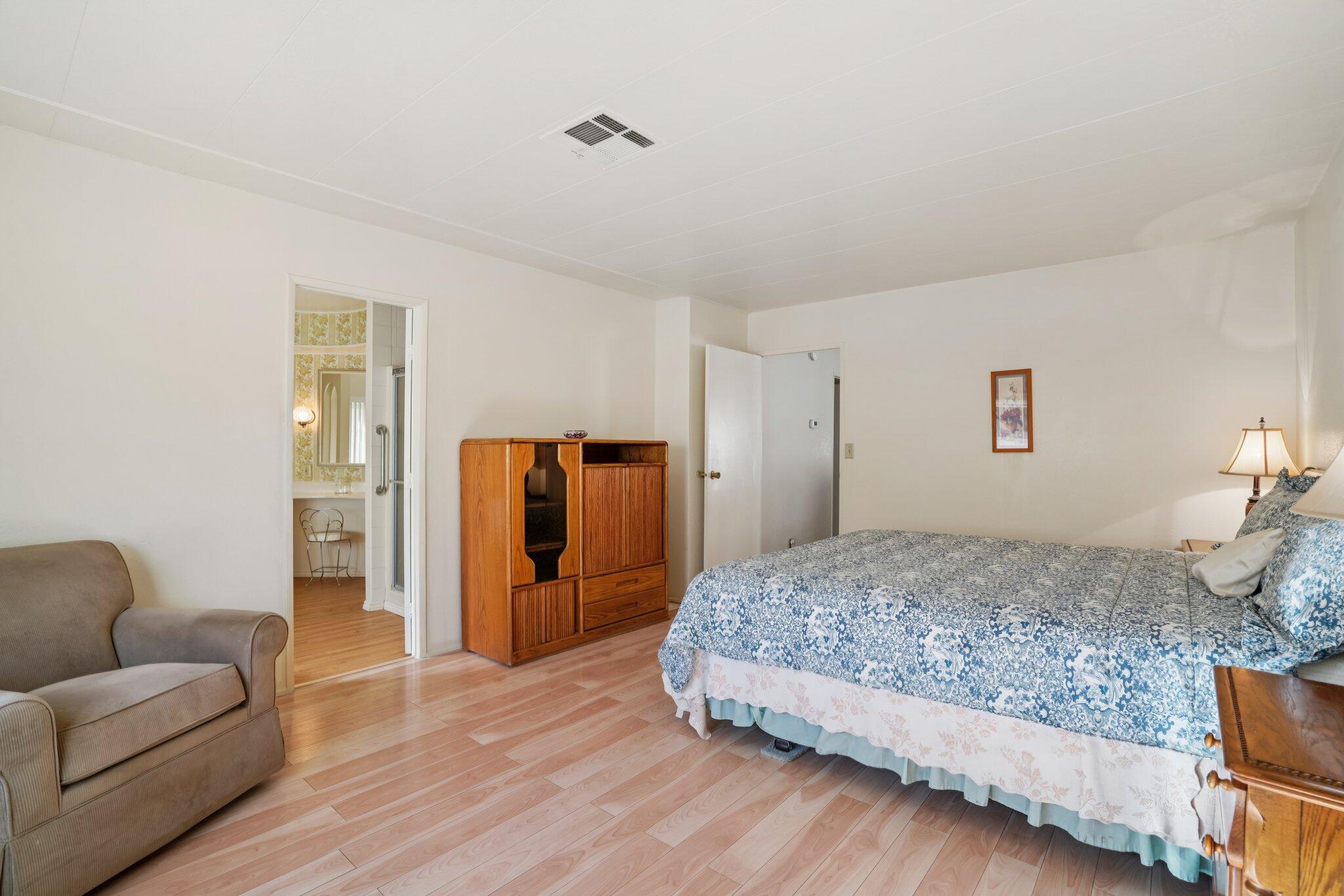 74584 Nevada Circle East Palm Desert, CA 92260 - Photo 22 of 46 a bedroom with a bed and a couch