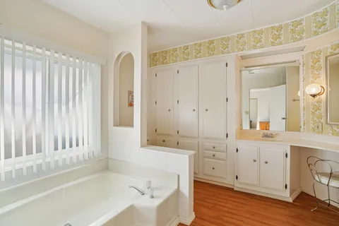 a bathroom with a bathtub and a sink