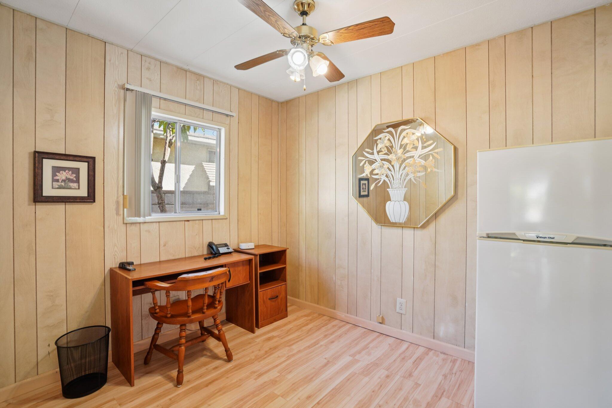 74584 Nevada Circle East Palm Desert, CA 92260 - Photo 31 of 46 a view of a workspace with furniture and a window