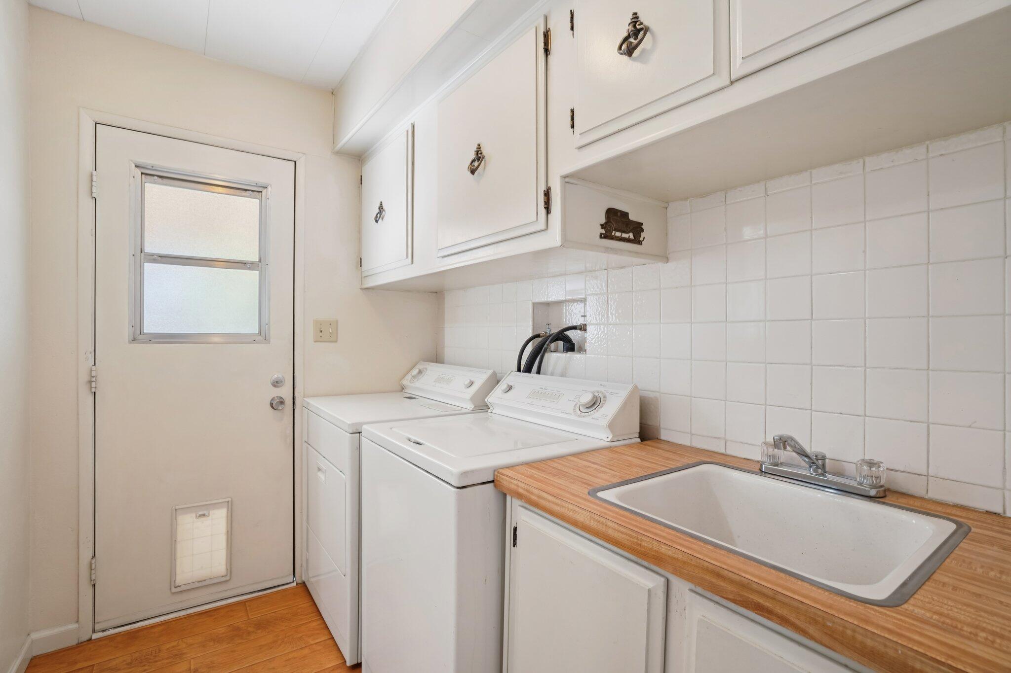 74584 Nevada Circle East Palm Desert, CA 92260 - Photo 33 of 46 a utility room with sink dryer and washer