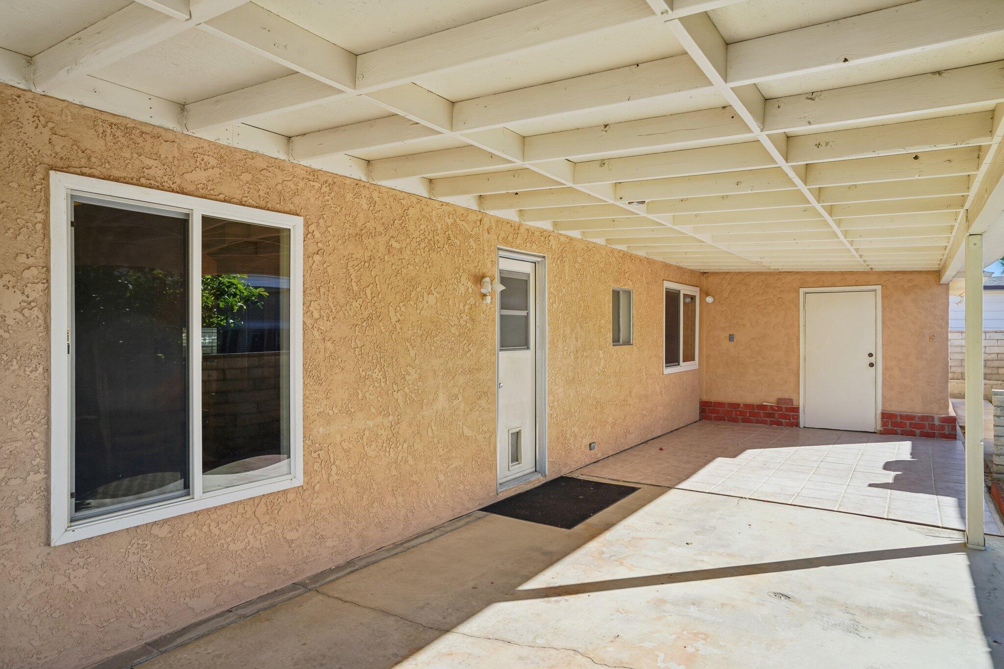 74584 Nevada Circle East Palm Desert, CA 92260 - Photo 35 of 46 a view of a big room with wooden floor and windows
