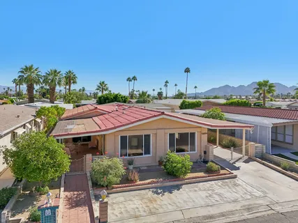 a view of a house with a garden