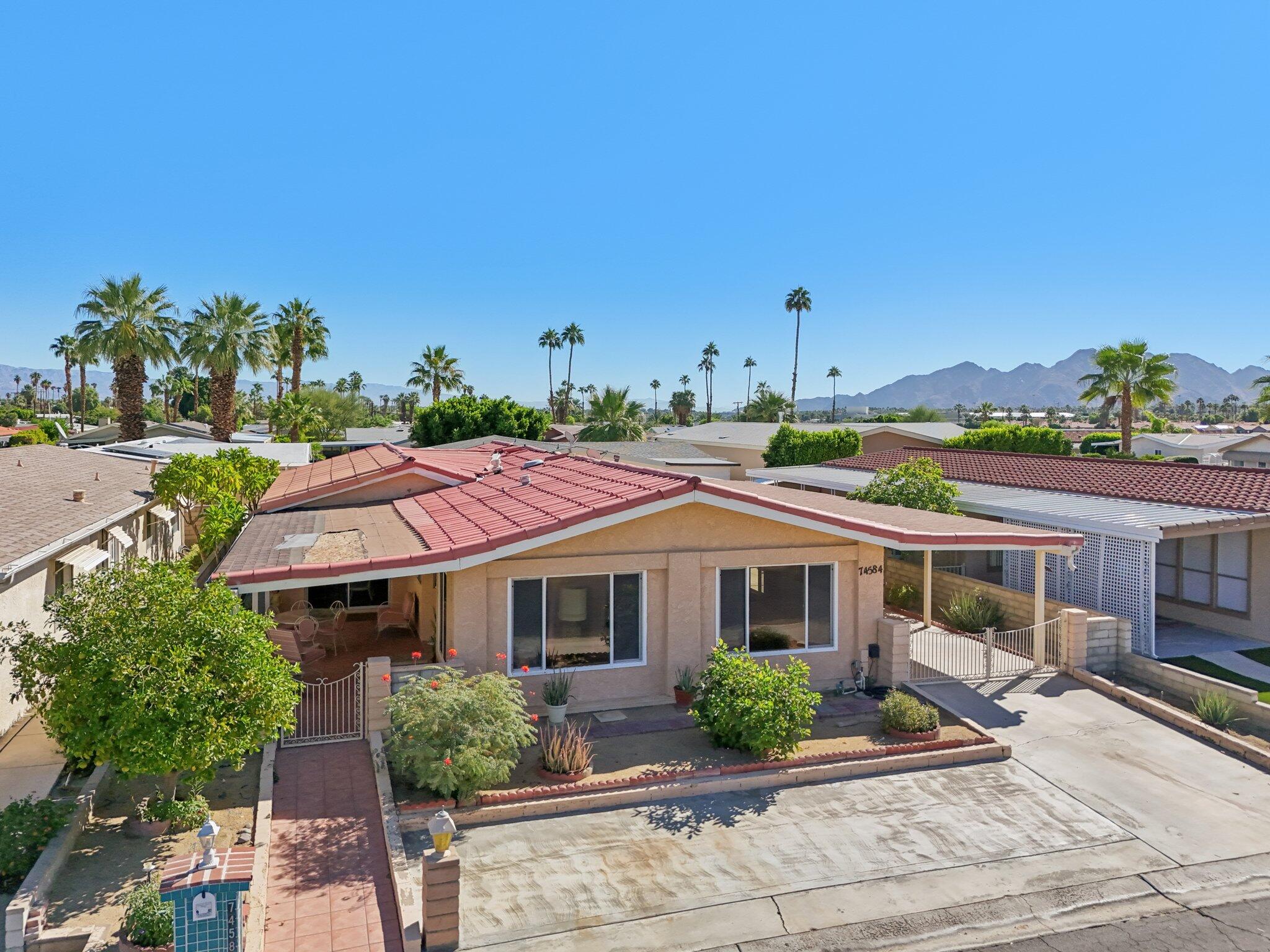 74584 Nevada Circle East Palm Desert, CA 92260 - Photo 39 of 46 a view of a house with a garden