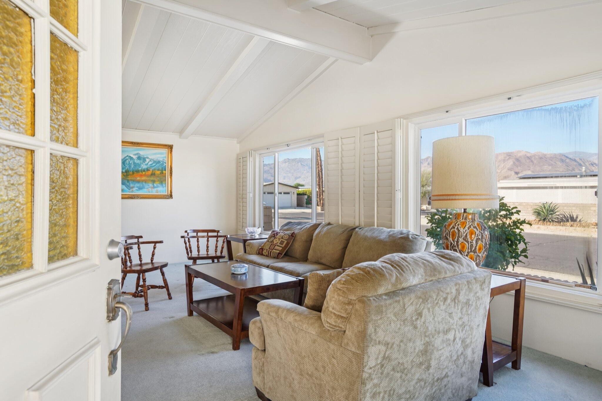 74584 Nevada Circle East Palm Desert, CA 92260 - Photo 5 of 46 a living room with furniture and a large window