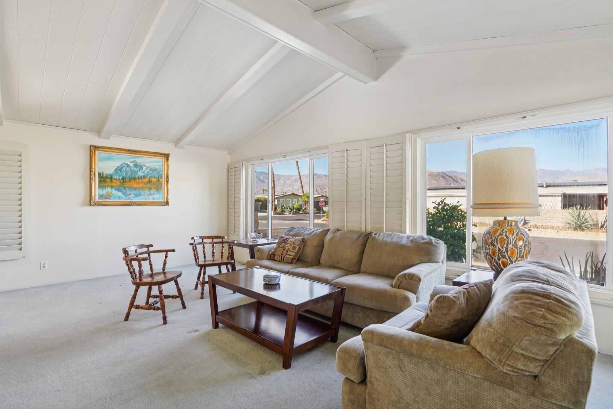 74584 Nevada Circle East Palm Desert, CA 92260 - Photo 6 of 46 a living room with furniture and a wooden floor