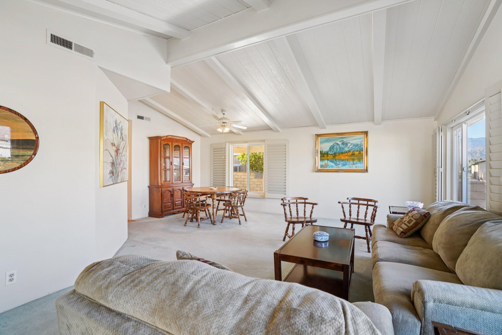 74584 Nevada Circle East Palm Desert, CA 92260 - Photo 7 of 46 a living room with furniture kitchen view and a window