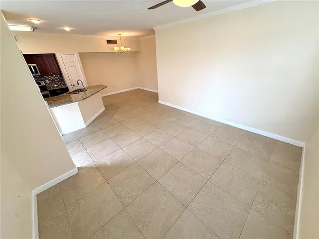 en empty room with a window and fireplace