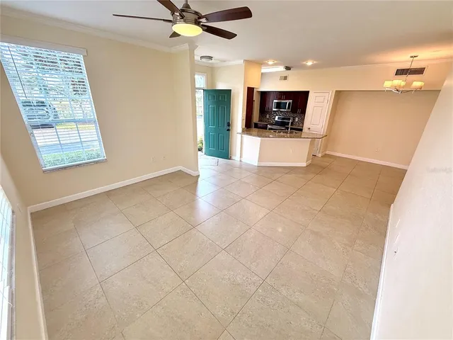 a view of a kitchen with furniture and a flat screen tv