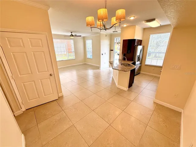 a kitchen with a stove and a refrigerator