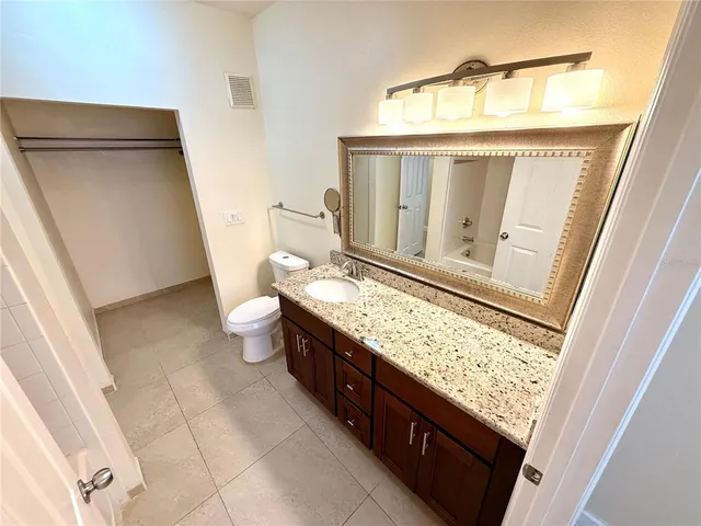 a view of living room with granite countertop furniture and fireplace